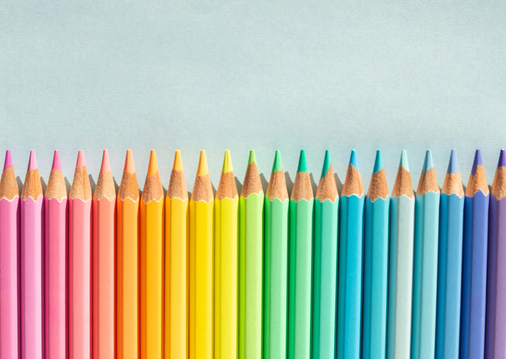 Colourful pencils in a row.